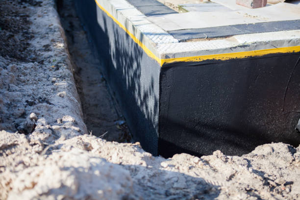 Professional Emergency Waterproofing technician working in East Liberty, OH